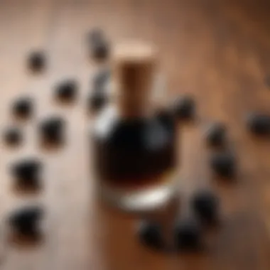 Close-up of black seed oil bottle on a wooden surface with fresh black seeds