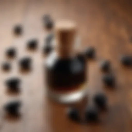 Close-up of black seed oil bottle on a wooden surface with fresh black seeds